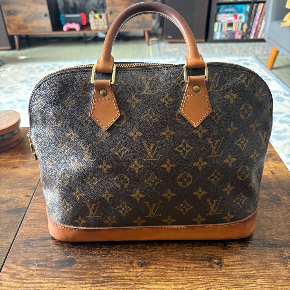 Louis Vuitton Alma Handbag